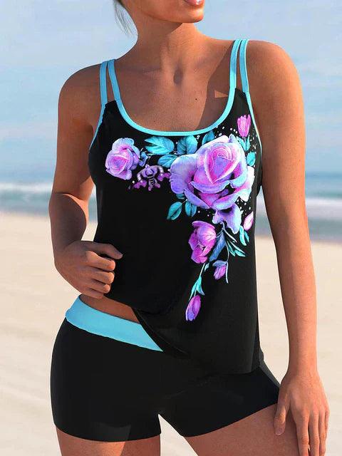 	Zwart-blauwe tankini met paarse rozenprint en short – sportieve en vrouwelijke zwemset