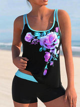 	Zwart-blauwe tankini met paarse rozenprint en short – sportieve en vrouwelijke zwemset
