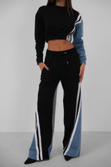 Taliya Tracksuit Damen schwarz mit Denimärmel und weitem Bein
