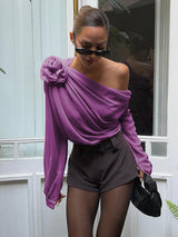 Paarse asymmetrische blouse met geplooide details