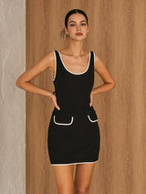 Elegante mouwloze jurk met piping details
