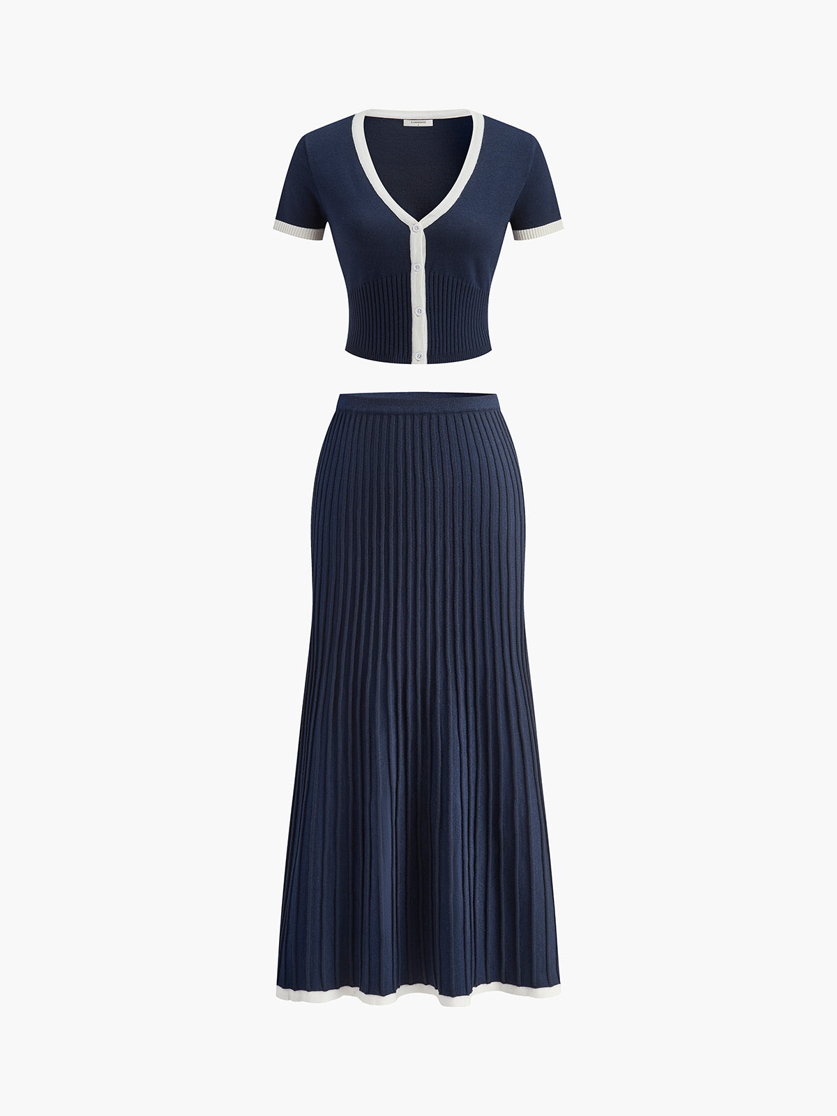 Flatlay van navy blauwe Clarisse set met contrasterende details
