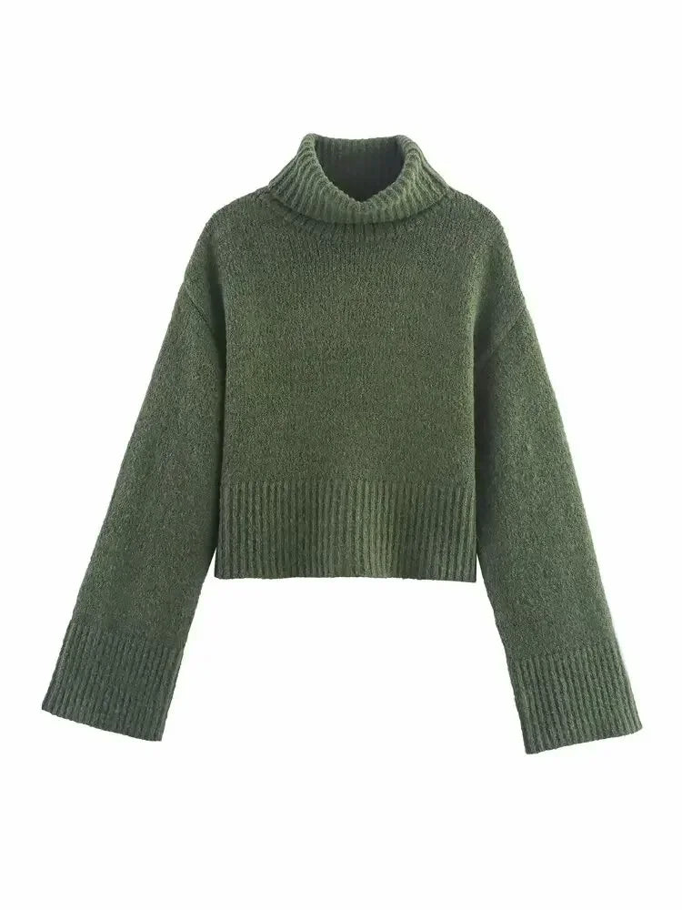 detailaufnahme grüner strickpullover mit rollkragen und geripptem bund