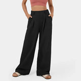 Faye Wide Leg Pantalon in zwart met hoge taille, comfortabele pasvorm en elegante wijde pijpen – ideaal voor werk en vrije tijd.