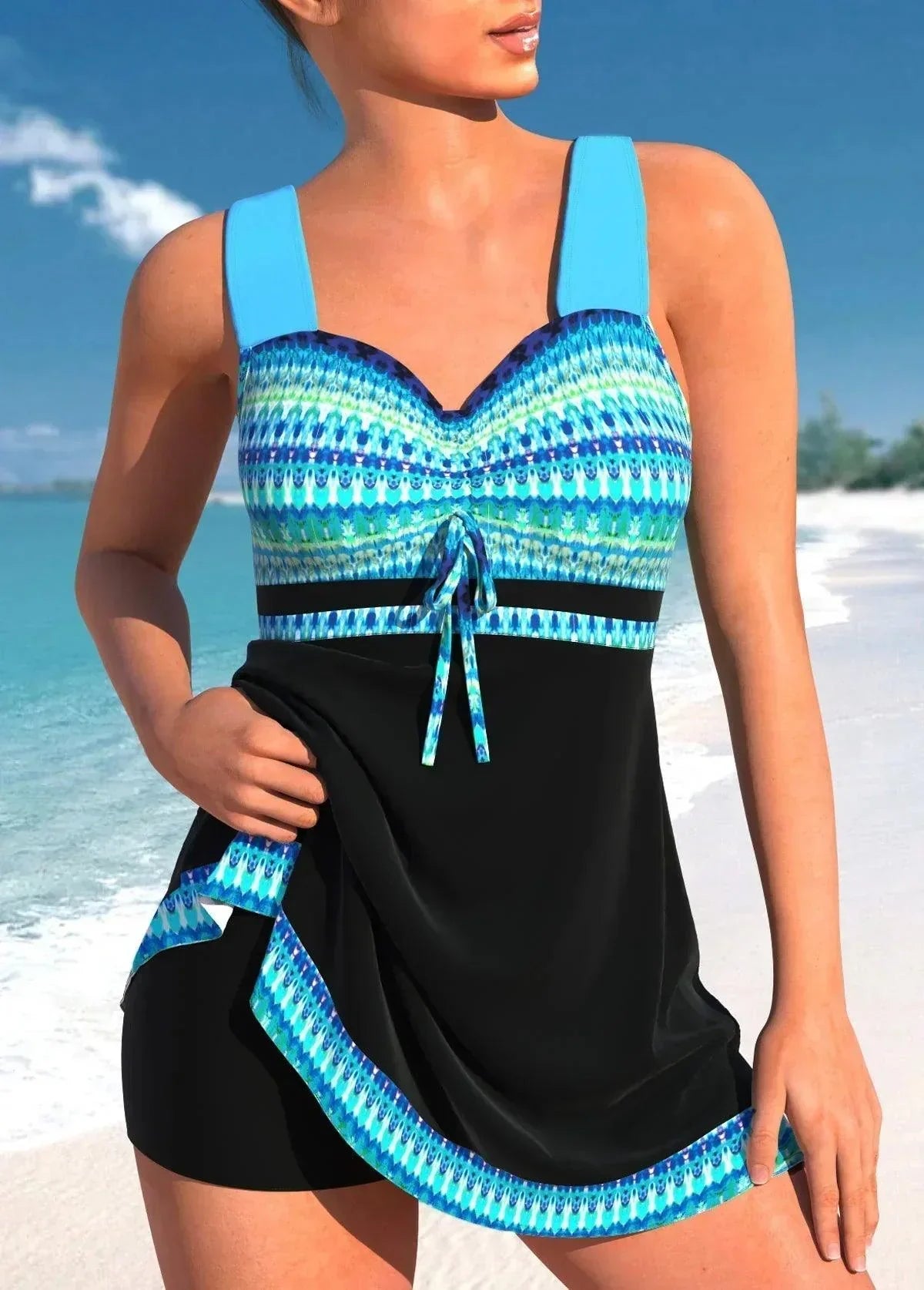 Zwart-blauwe tankinijurk met turquoise tribal details – shaping swimwear met brede bandjes