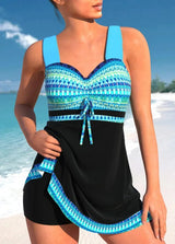 Zwart-blauwe tankinijurk met turquoise tribal details – shaping swimwear met brede bandjes