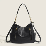 zwarte leren hobo schoudertas met gouden hardware en afneembare band
