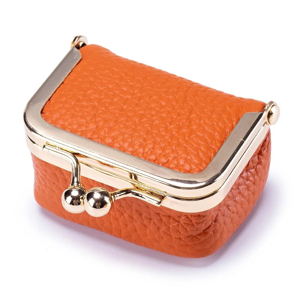 oranje miniportemonnee van leer met retro kliksluiting