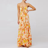 Zomerse strapless maxi jurk met oranje en gele bloemen