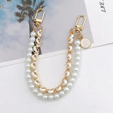 gouden ketting en parel tas hanger
