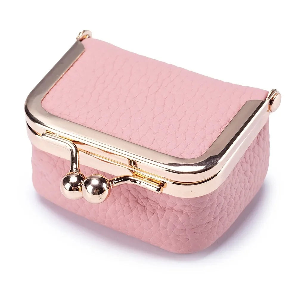 roze miniportemonnee van leer met retro kliksluiting