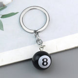 Tashanger met metalen ring en 8-ball bedel – simpel en stoer design