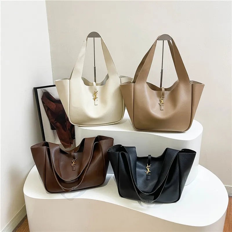 Ruime handtas in zwart, beige, bruin en camel voor dames
