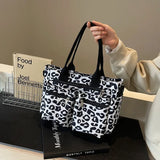 Roar Chic Tote – ruime leopardprint tas met stevige schouderbanden en meerdere ritsvakken, perfect voor dagelijks gebruik.
