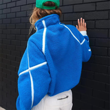Blauwe half-zip sweater met verstelbare zijkoorden, vooraanzicht.