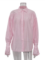 Roze damesblouse met elegante manchetten en knoopsluiting
