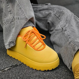 Zijkant van de Agostina Sneakers met stevige rubberen zool.