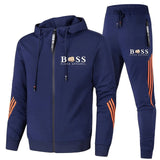 navy blauwe sportset met oranje details en comfortabele pasvorm