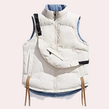 Bodywarmer in wit met afneembaar tasje, verstelbare trekkoorden en ademend materiaal. Warm, stijlvol en functioneel.
