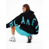 Blayen Oversized Sweatshirt Damen Schwarz mit großem Türkisem Backprint – Talaine