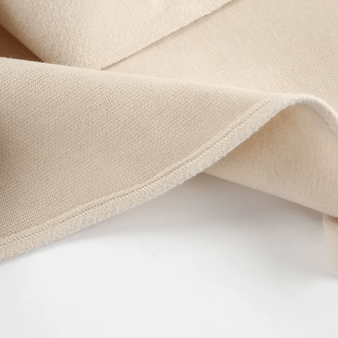 Stoffdetail Dalara Mantel, weiche Struktur
