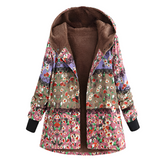 Blauwe, groene en roze damesjas

