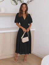 Elegante jurk met pofmouwen

